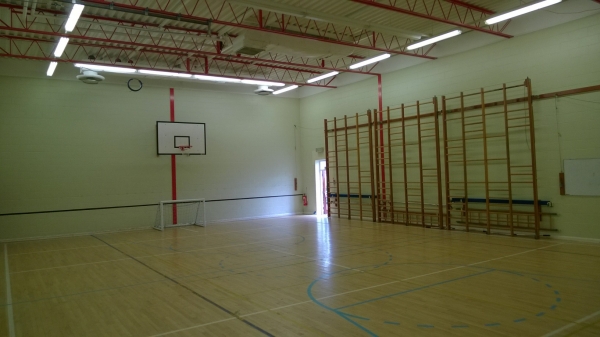 The gymnasium, an intimate space with a sprung wooden floor. 